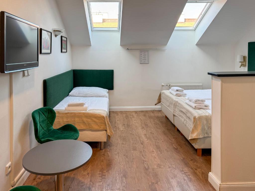 Postel nebo postele na pokoji v ubytování Hotel Malá Strana
