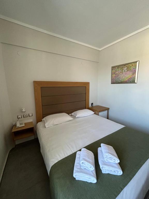 Postel nebo postele na pokoji v ubytování Perea Hotel