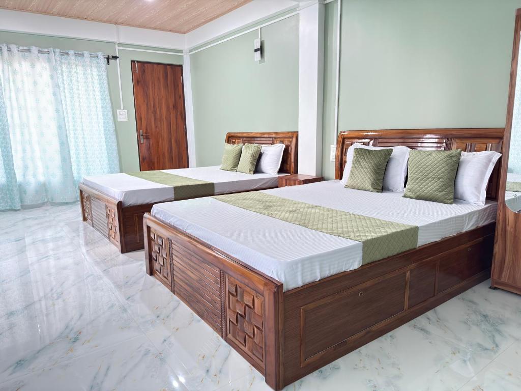 Postel nebo postele na pokoji v ubytování Maple Homestay