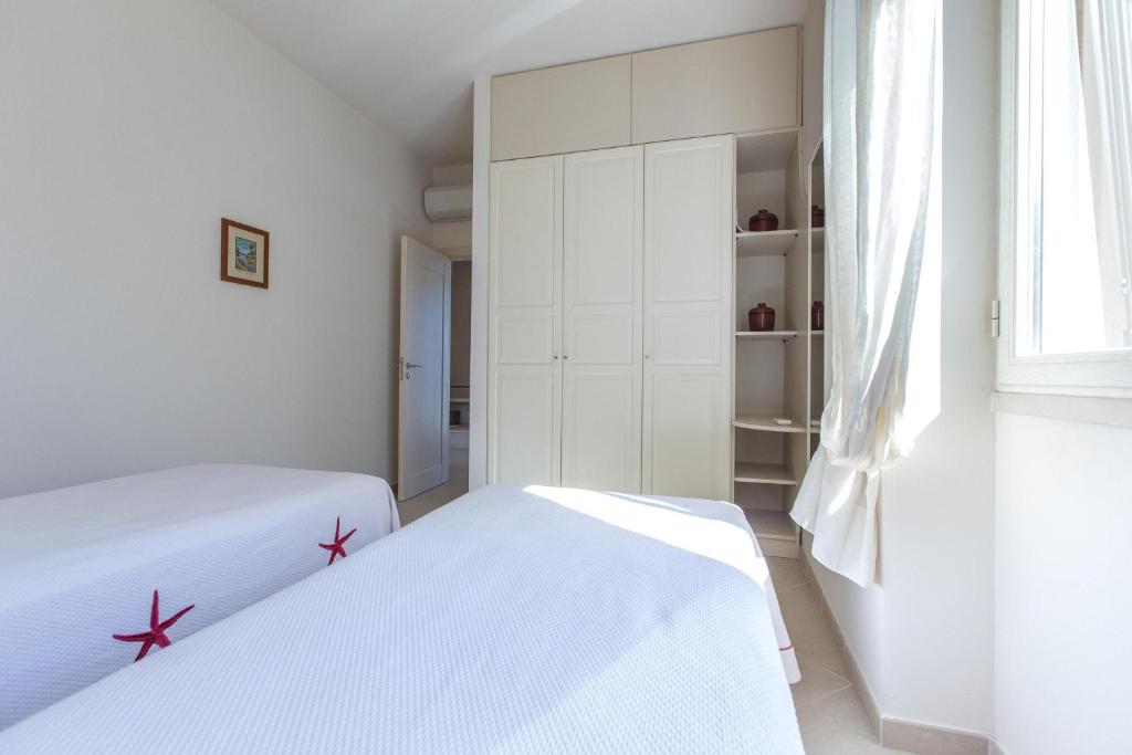 Posteľ alebo postele v izbe v ubytovaní Villa Fanò by Perle di Puglia