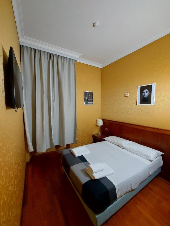 Postel nebo postele na pokoji v ubytování Hotel Positano 2 MIMOSA