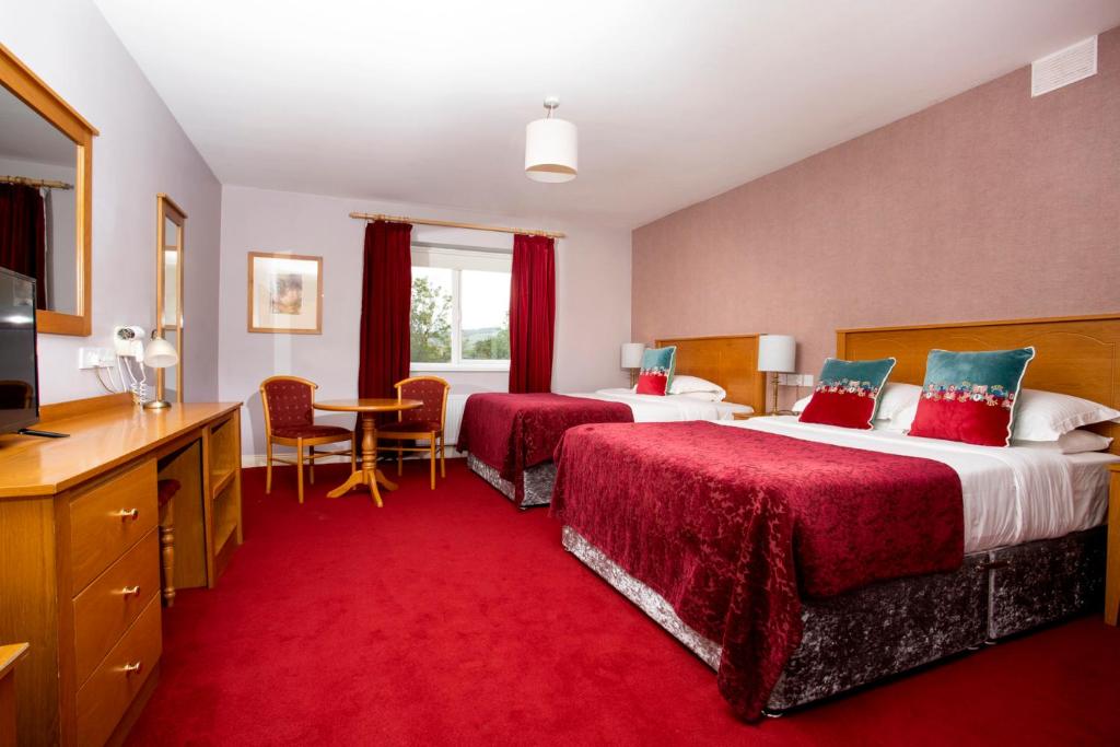 Postel nebo postele na pokoji v ubytování Donegal Manor