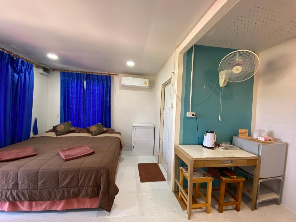 Postel nebo postele na pokoji v ubytování Patcharin Homestay