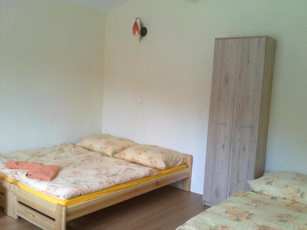 Postel nebo postele na pokoji v ubytování Penzion Apartmány Bečov