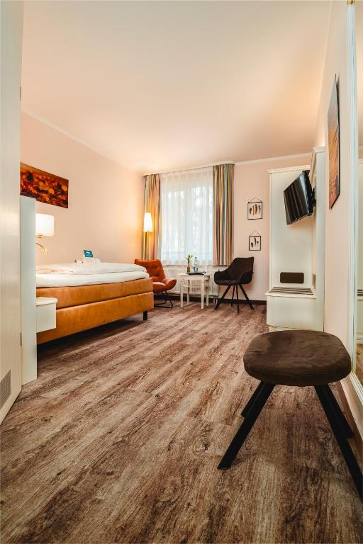 TV a/nebo společenská místnost v ubytování Hotel Wilhelmshöhe