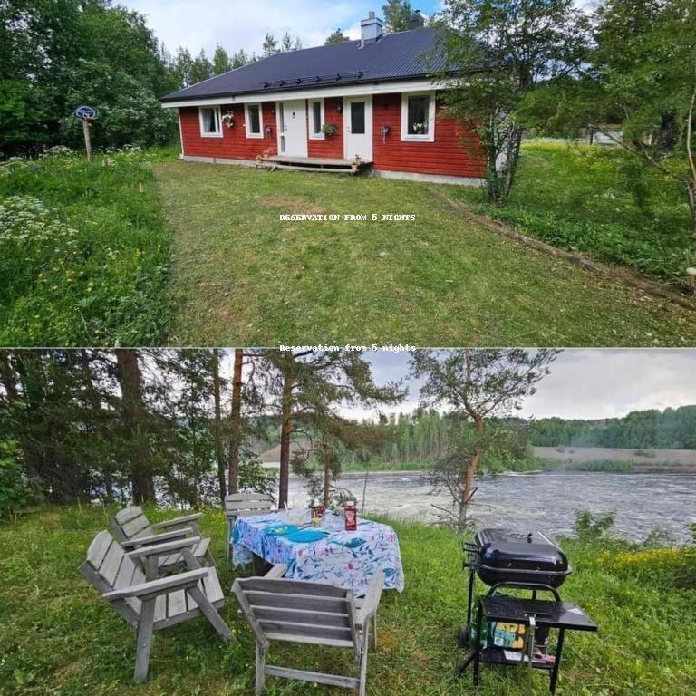 a red house with a picnic table and a grill at Hammarstrandvilla in Hammarstrand