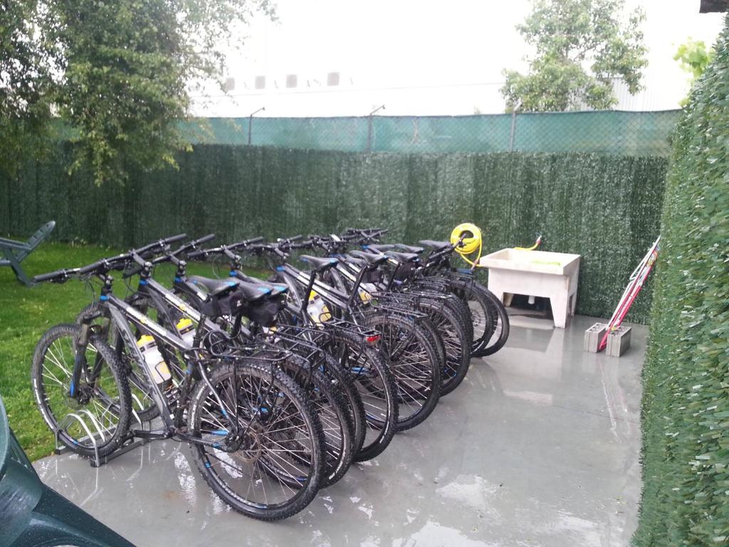 
a row of bikes parked next to each other at Albergue San Anton in Melide
