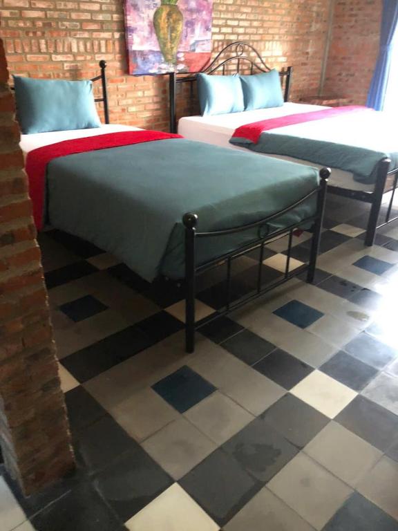 Postel nebo postele na pokoji v ubytování Calm House 3 Boutique hotel Hoi An