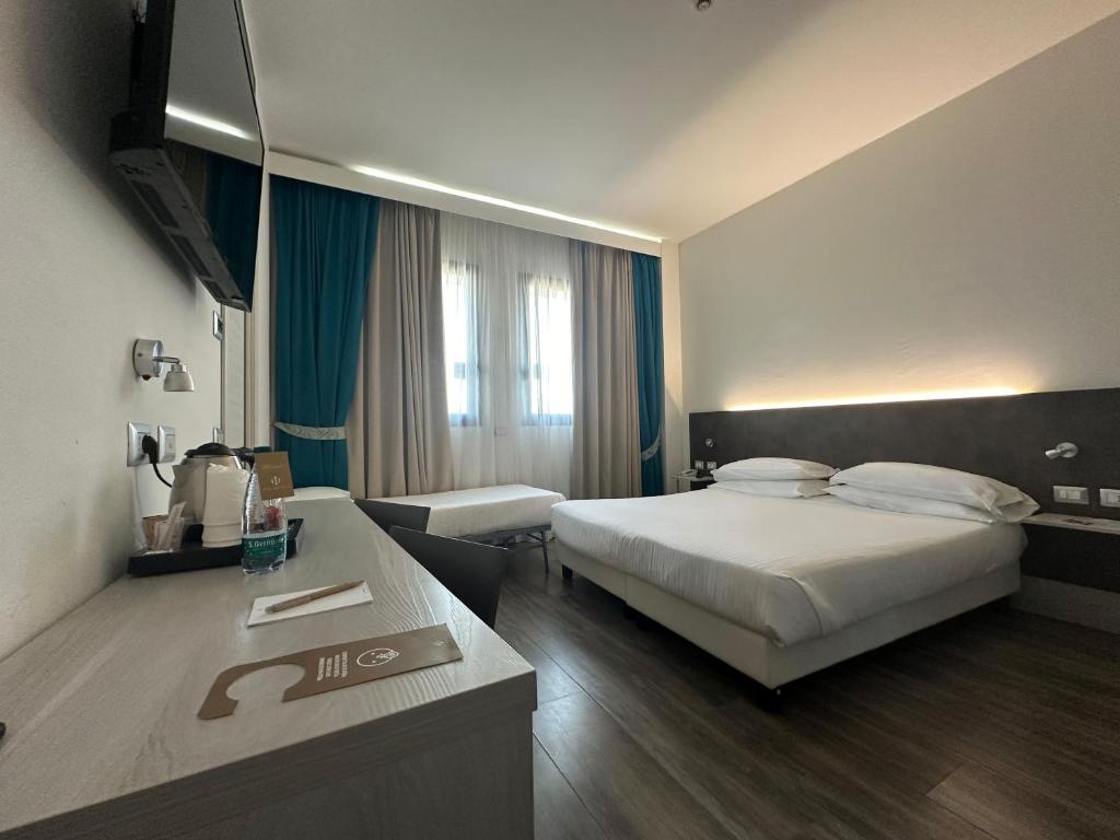 Łóżko lub łóżka w pokoju w obiekcie Phi Hotel Milano