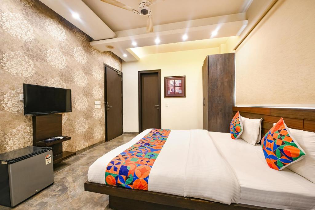 Postel nebo postele na pokoji v ubytování FabHotel Micasa