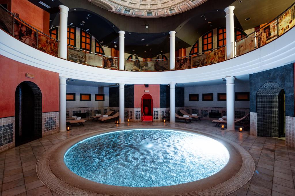 a large pool in the middle of a building at Castilla Termal Solares in Solares