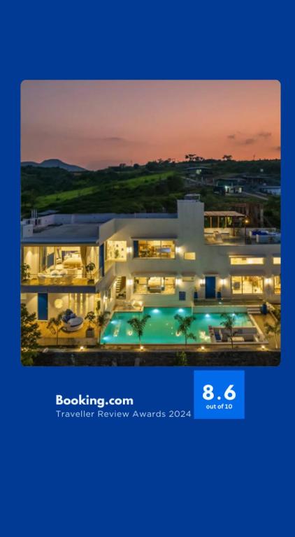 a picture of a large house with a pool at EKOSTAY Luxe - Hercules Villa in Igatpuri