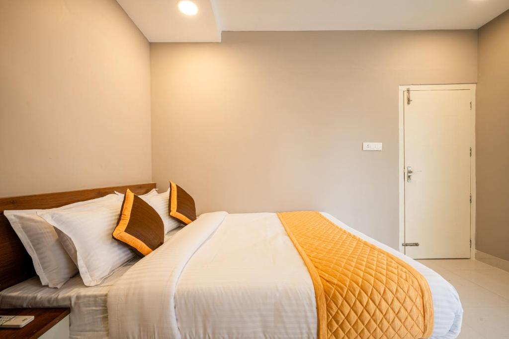 Postel nebo postele na pokoji v ubytování Daan Temple Inn