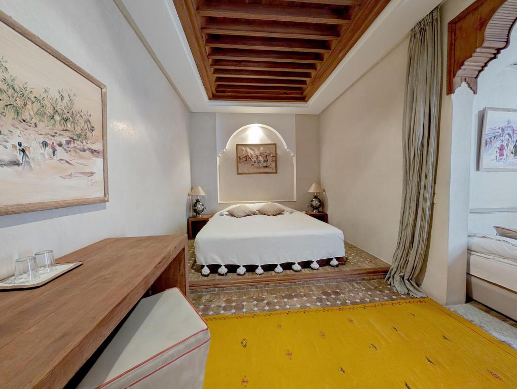 Postel nebo postele na pokoji v ubytování Riad Slitine & Spa