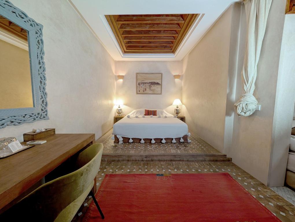 Postel nebo postele na pokoji v ubytování Riad Slitine & Spa