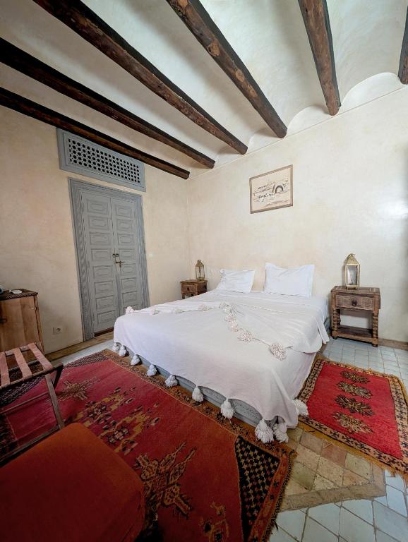 Postel nebo postele na pokoji v ubytování Riad Slitine & Spa