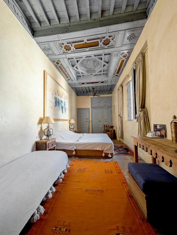 Postel nebo postele na pokoji v ubytování Riad Slitine & Spa