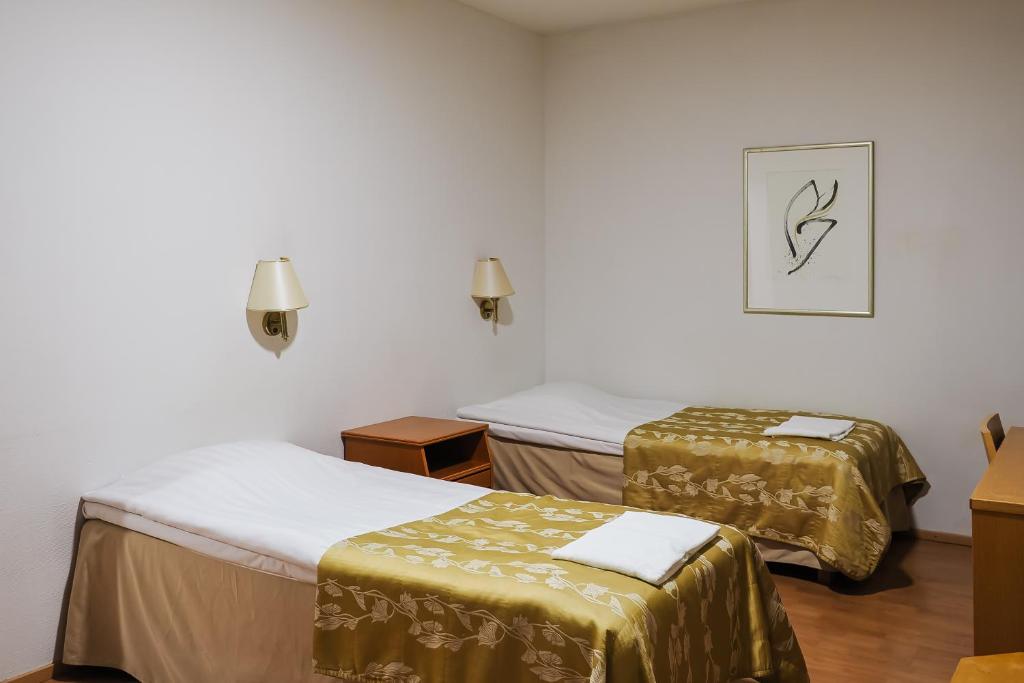 Postel nebo postele na pokoji v ubytování Finlandia Park Hotel Helsinki