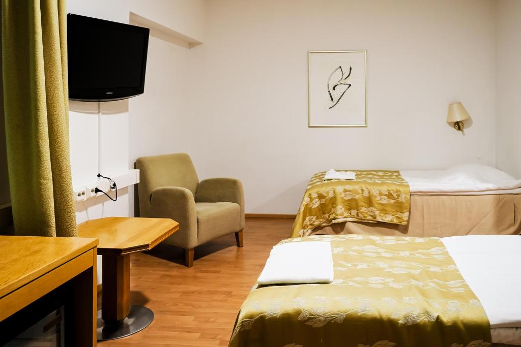 Postel nebo postele na pokoji v ubytování Finlandia Park Hotel Helsinki