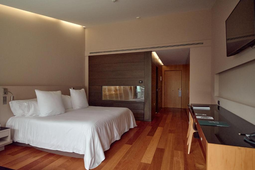 Postel nebo postele na pokoji v ubytování Andorra Park Hotel