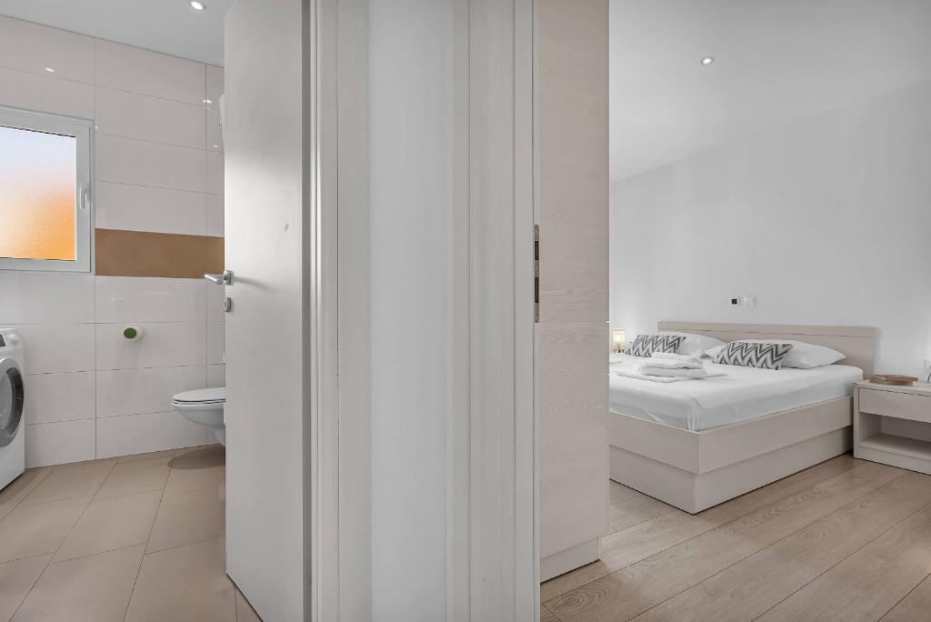 Postel nebo postele na pokoji v ubytování Blue Dream Apartment