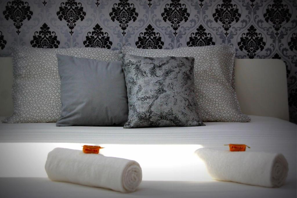 Postel nebo postele na pokoji v ubytování R.Gold Apartman