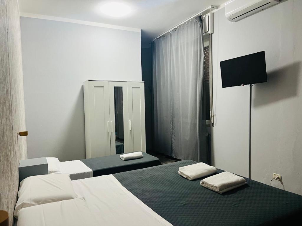 Postel nebo postele na pokoji v ubytování Il Galileo Rooms