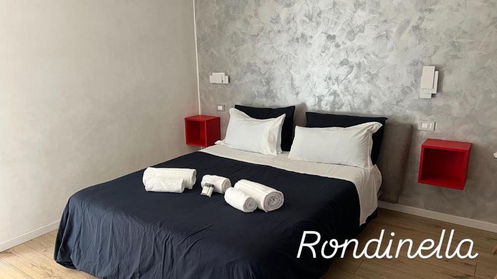 Posteľ alebo postele v izbe v ubytovaní san rocco apartments