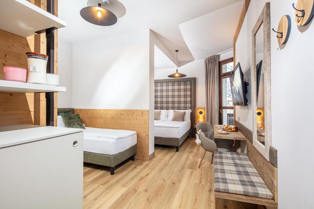 Cama o camas de una habitación en Hotel Nigritella