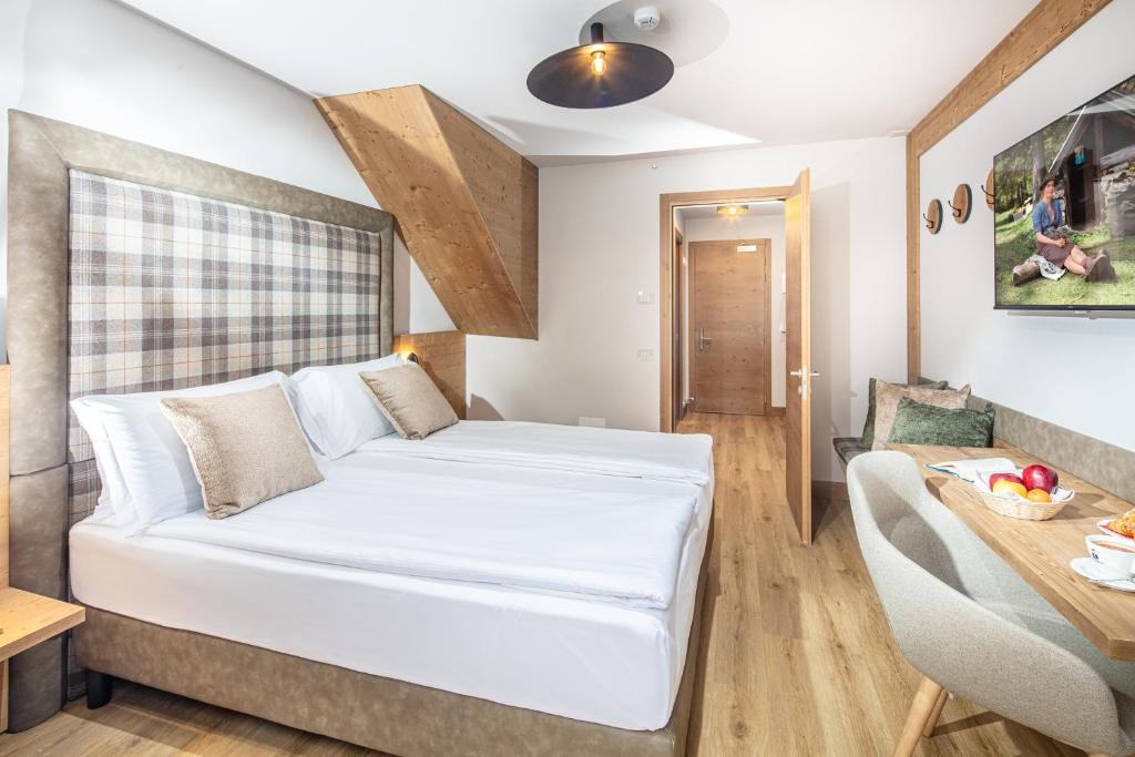 Cama o camas de una habitación en Hotel Nigritella