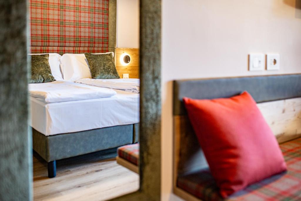 Cama o camas de una habitación en Hotel Nigritella