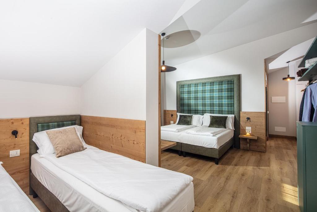 Cama o camas de una habitación en Hotel Nigritella