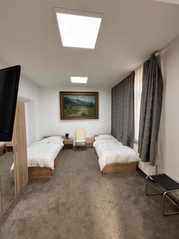 Ένα ή περισσότερα κρεβάτια σε δωμάτιο στο Twin-Tam House