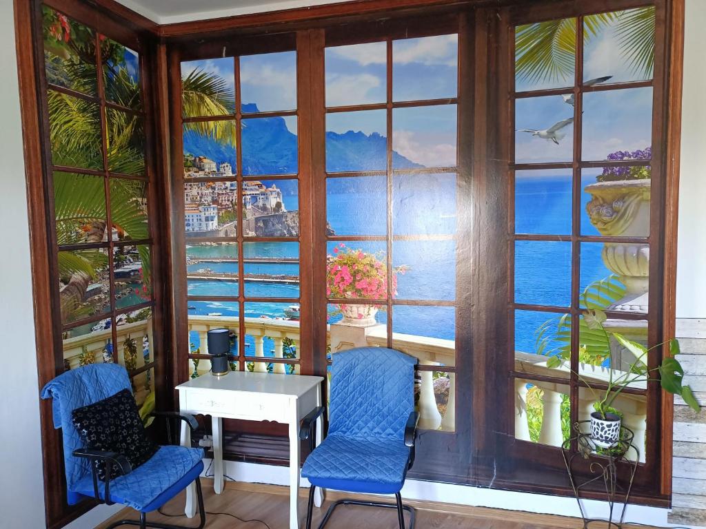 a room with a window with a view of the ocean at Centrum 2pokoje 4łożka przy MACDonald ulica Witosa 1 in Piła