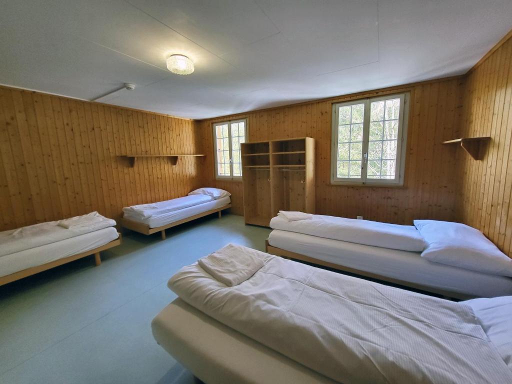 Postel nebo postele na pokoji v ubytování Nordic Arena House