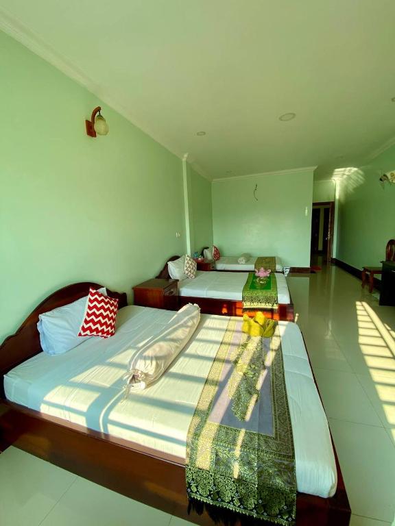 Postel nebo postele na pokoji v ubytování Chan Sothea Guest House