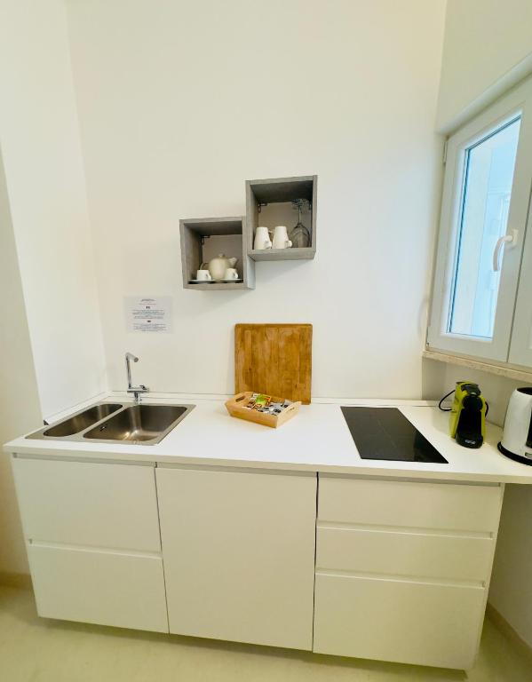 Kuchyň nebo kuchyňský kout v ubytování Amoredimare Casa Vacanze