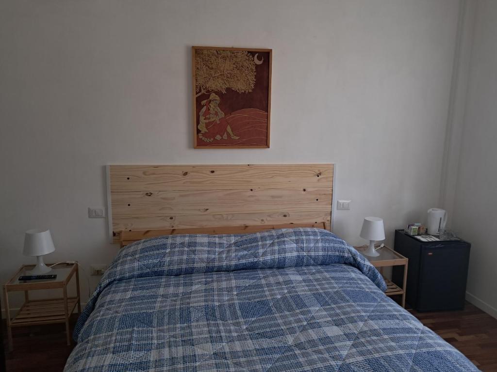 Postel nebo postele na pokoji v ubytování B&B Il canale