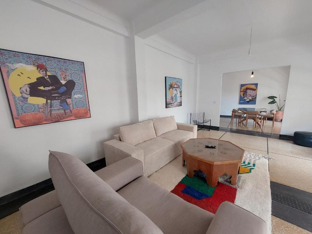 a living room with a couch and a table at Dar Collon in Tangier