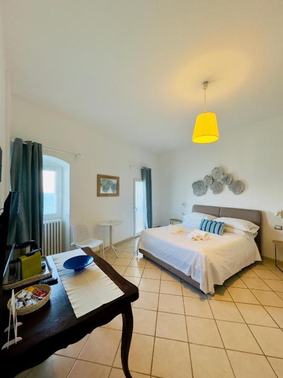 Postel nebo postele na pokoji v ubytování Amoredimare Casa Vacanze