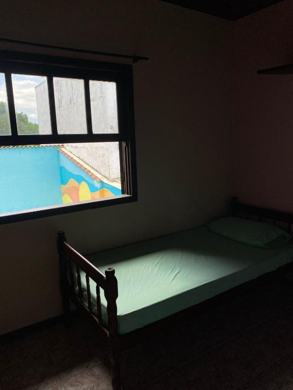 Postel nebo postele na pokoji v ubytování Meraki Hostel e Turismo