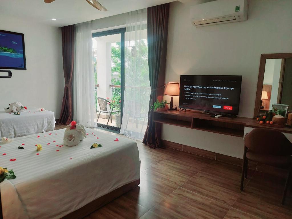 Postel nebo postele na pokoji v ubytování An Villa Beach Paradise