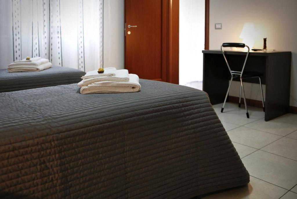 Postel nebo postele na pokoji v ubytování B&B Il Sasso Antico