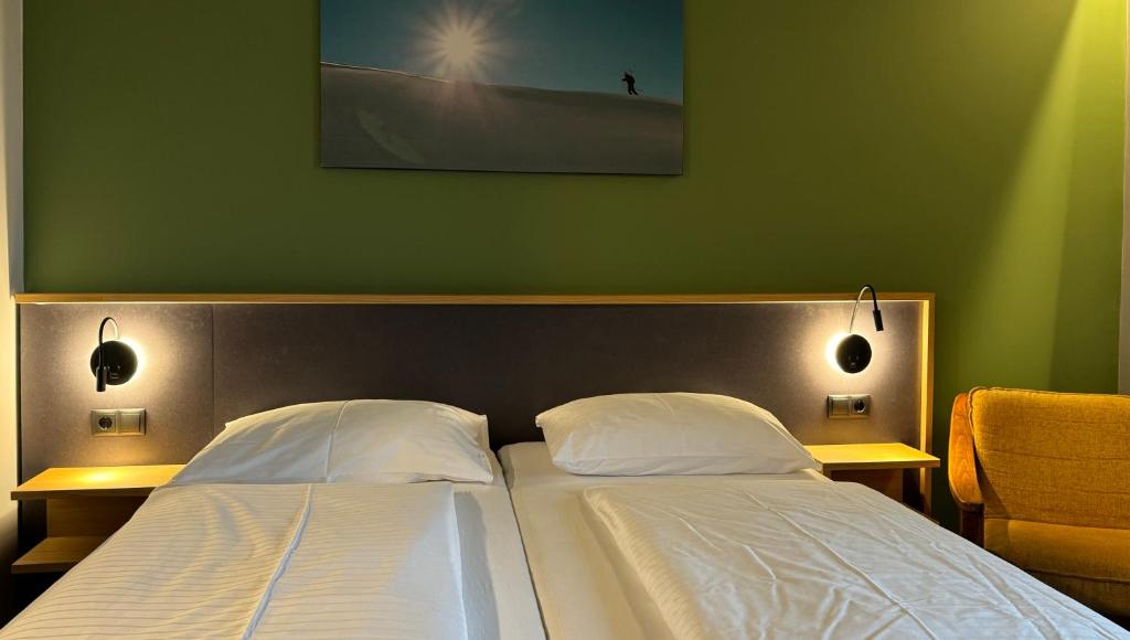 Ein Bett oder Betten in einem Zimmer der Unterkunft Hotel Simader