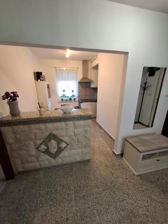 a kitchen with a stone counter in a room at Morena in Pula