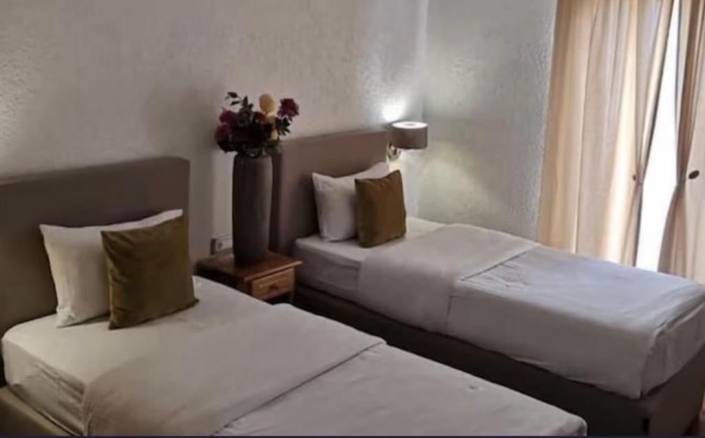 Postel nebo postele na pokoji v ubytování Hotel Garni Ideal