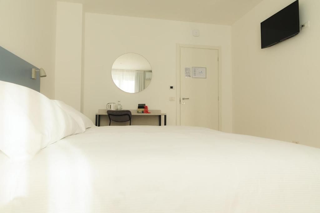 Postel nebo postele na pokoji v ubytování Albergo Sappia