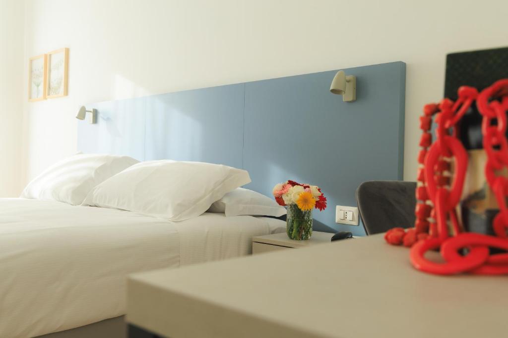 Postel nebo postele na pokoji v ubytování Albergo Sappia