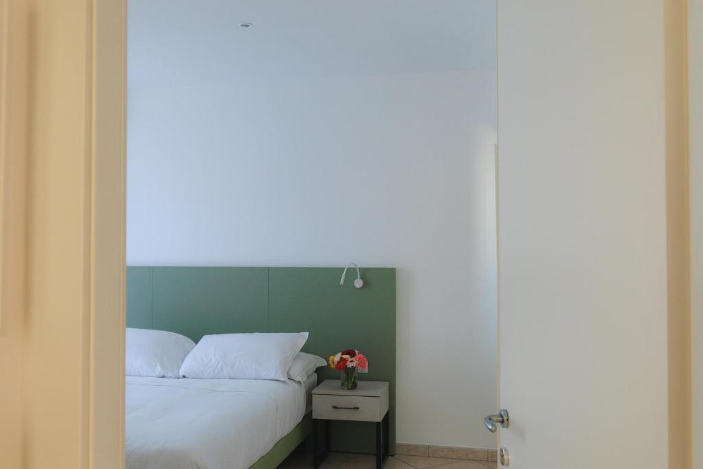 Postel nebo postele na pokoji v ubytování Albergo Sappia
