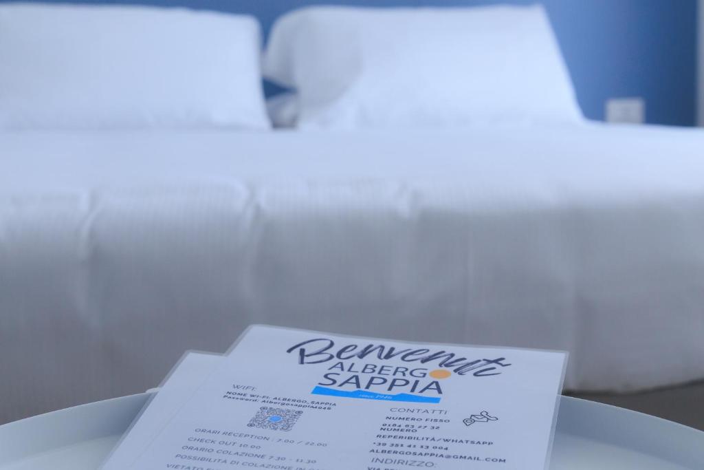 Postel nebo postele na pokoji v ubytování Albergo Sappia